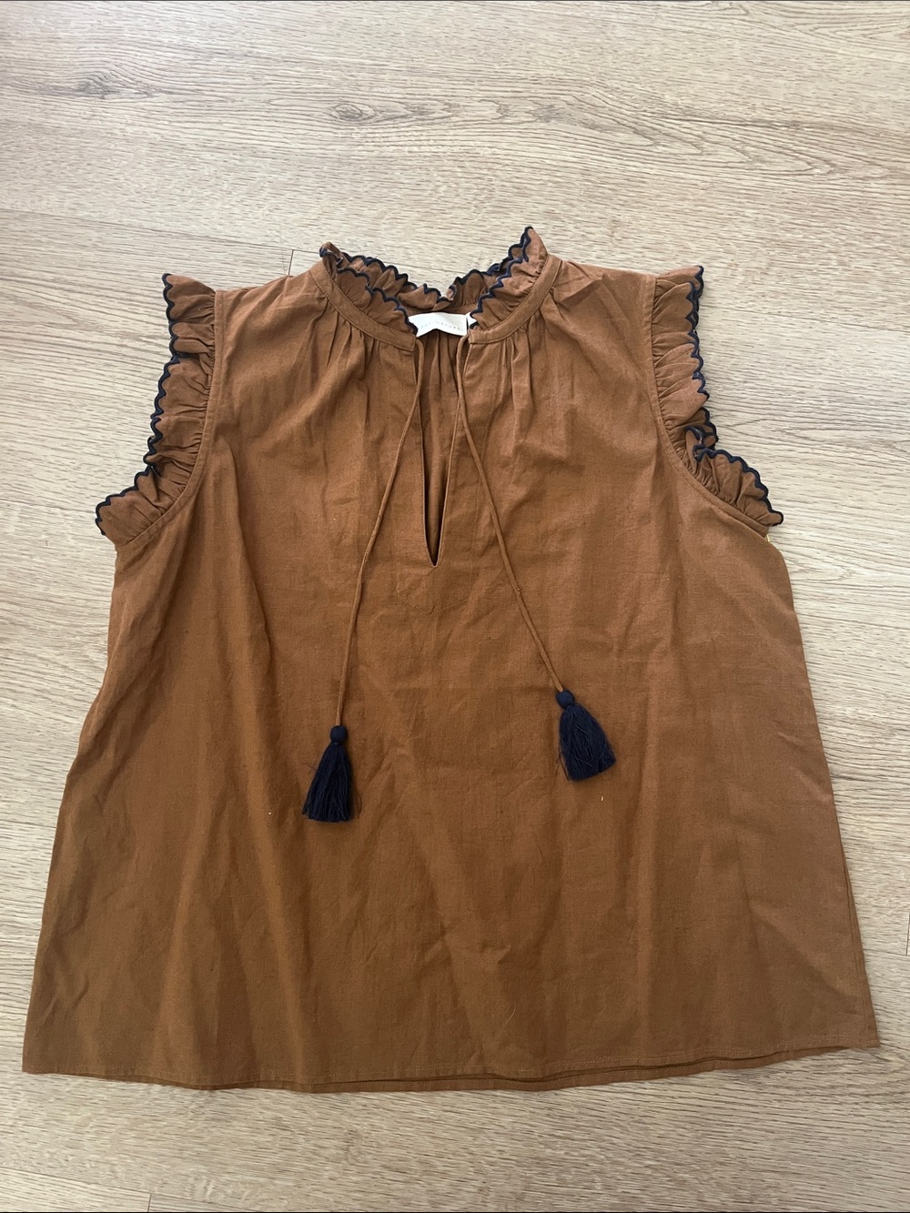 Sleeveless Ruffle Tassel Blouse in Rust with Black Trim